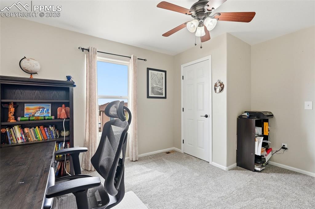 6907 Shimmering Leaf Road Colorado Springs, CO 80908 - Photo 37 of 49 a view of a room with gym equipment