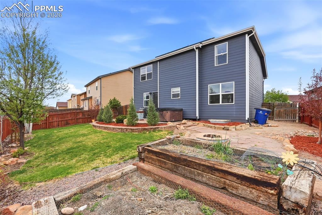 6907 Shimmering Leaf Road Colorado Springs, CO 80908 - Photo 45 of 49 a front view of a house with garden