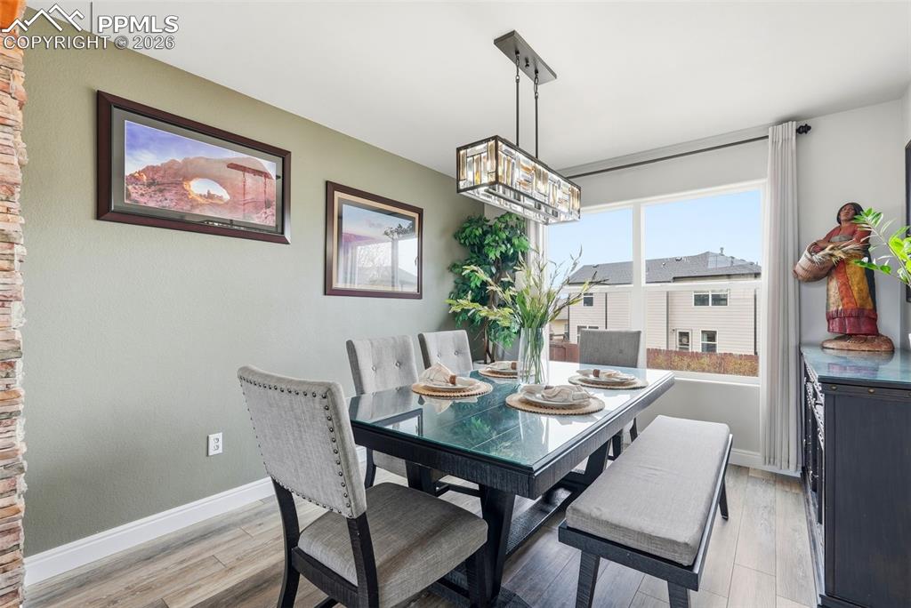 6907 Shimmering Leaf Road Colorado Springs, CO 80908 - Photo 5 of 49 a view of a dining room with furniture