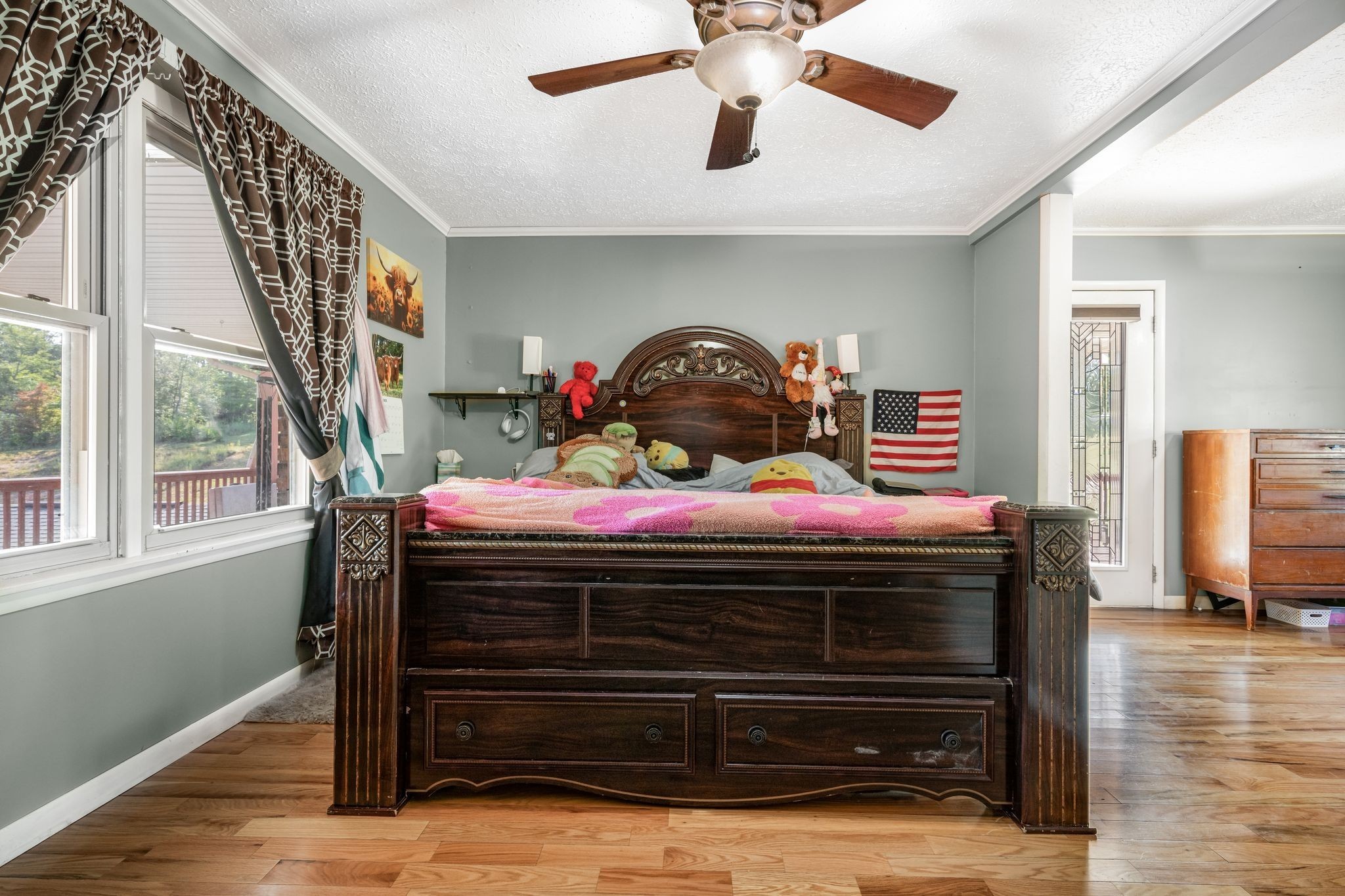 298 Langford Road Waverly, TN 37185 - Photo 16 of 53 a bedroom with a bed and a chandelier