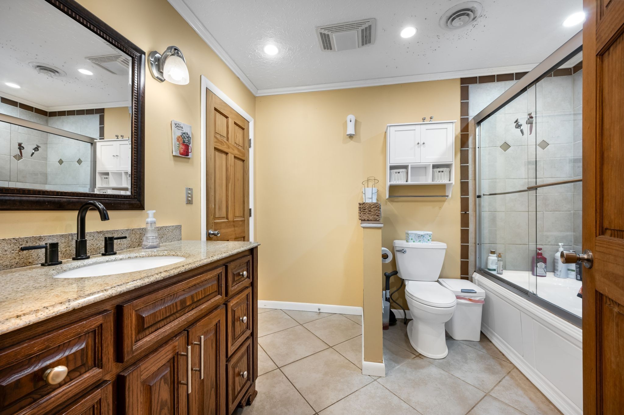298 Langford Road Waverly, TN 37185 - Photo 20 of 53 a bathroom with a granite countertop sink toilet and mirror