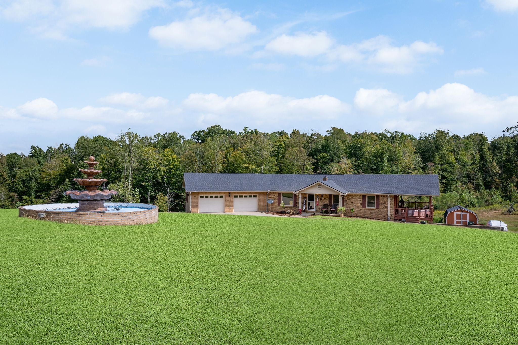 298 Langford Road Waverly, TN 37185 - Photo 2 of 53 a view of a house with swimming pool and sitting area