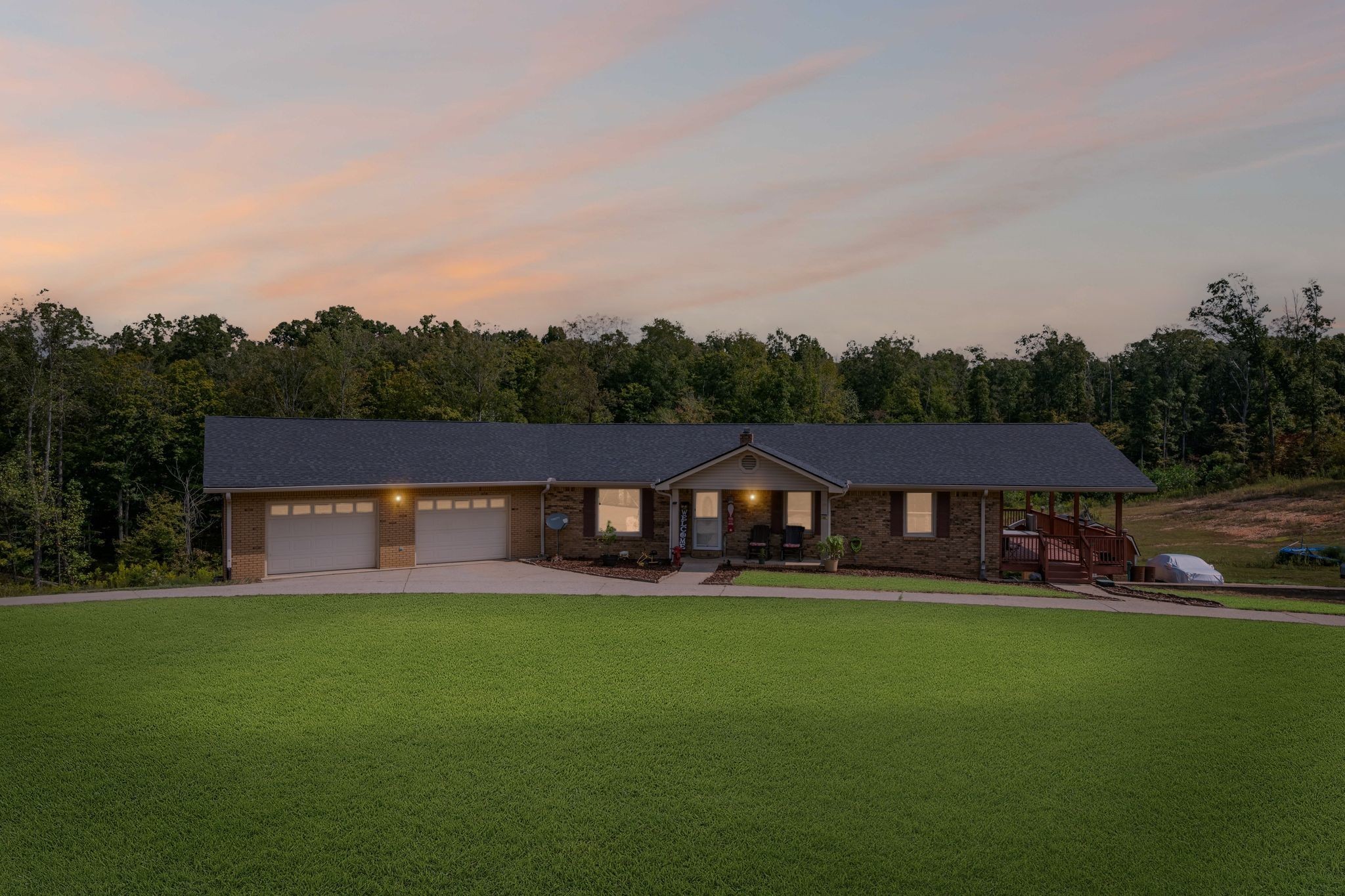 298 Langford Road Waverly, TN 37185 - Photo 3 of 53 a front view of a house with garden