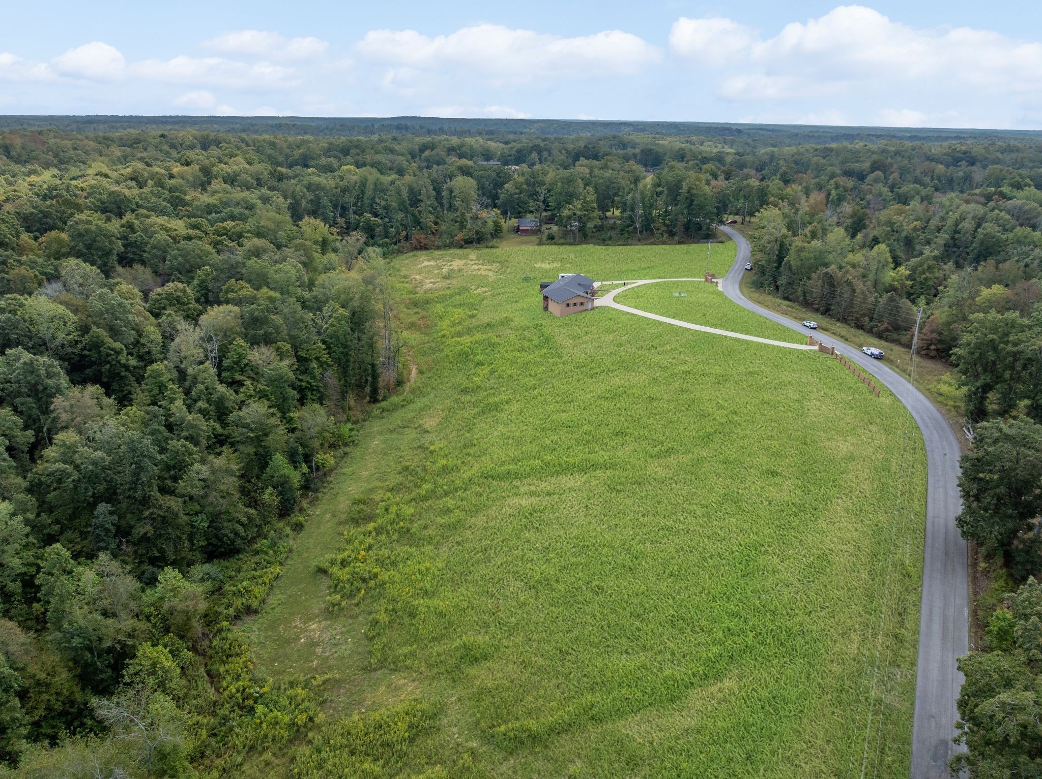 298 Langford Road Waverly, TN 37185 - Photo 44 of 53 a view of a green yard with a lake