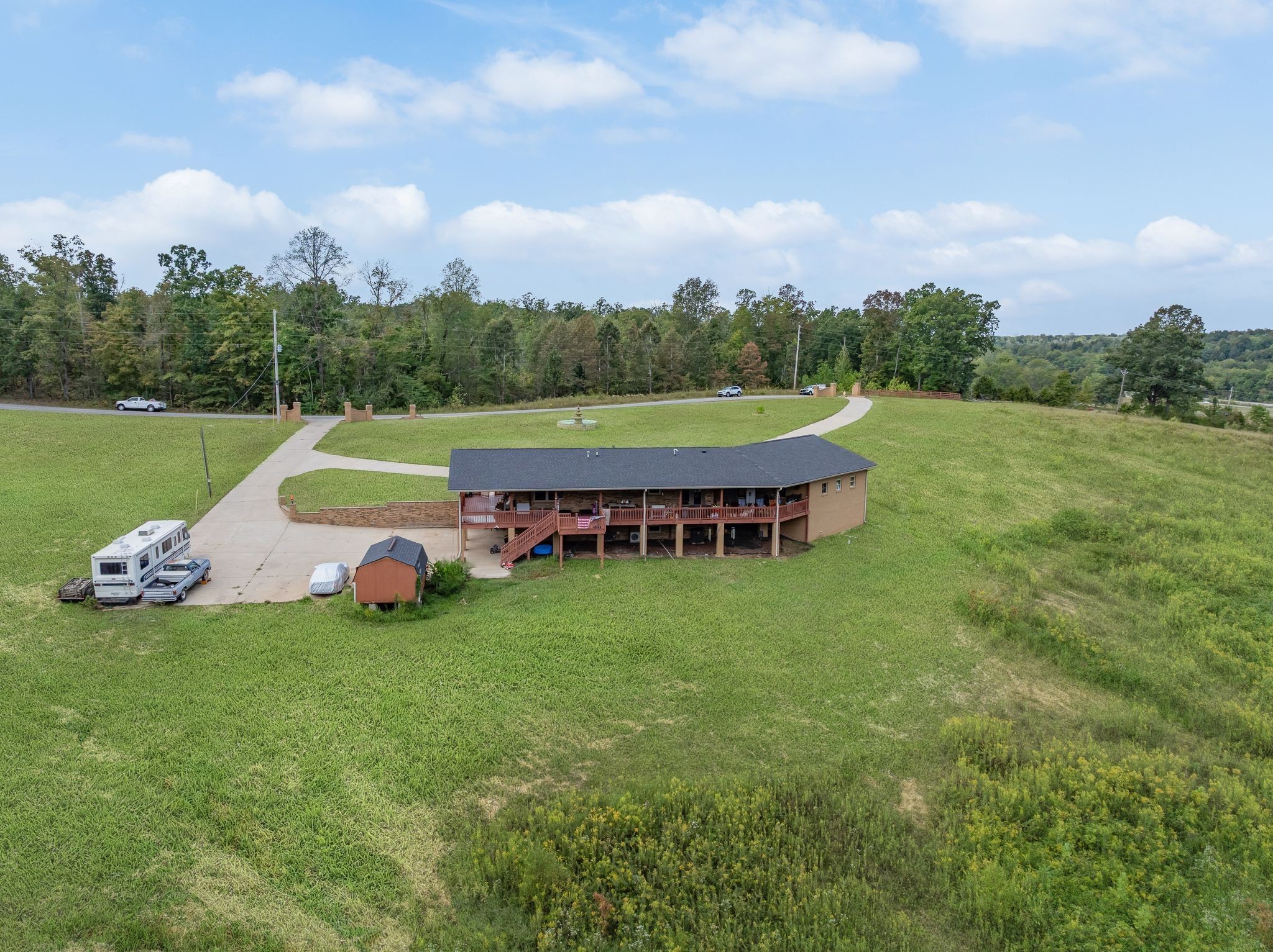 298 Langford Road Waverly, TN 37185 - Photo 48 of 53 a view of a yard with furniture and lake view