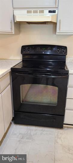 11601 Lighthouse Drive Laurel, MD 20708 - Photo 11 of 21 Sleek black stove in modern kitchen.