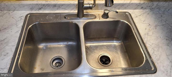 11601 Lighthouse Drive Laurel, MD 20708 - Photo 12 of 21 Sleek stainless steel sink design.