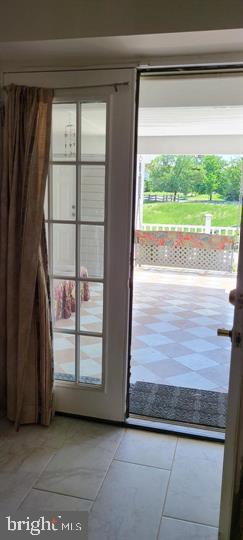 11601 Lighthouse Drive Laurel, MD 20708 - Photo 13 of 21 Inviting entryway to serene outdoors.