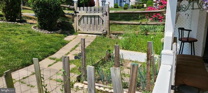 11601 Lighthouse Drive Laurel, MD 20708 - Photo 6 of 21 Charming garden with rustic gate.