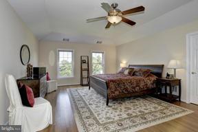2101 Link Road Silver Spring, MD 20905 - Photo 14 of 30 a bedroom with a bed a window and a chandelier