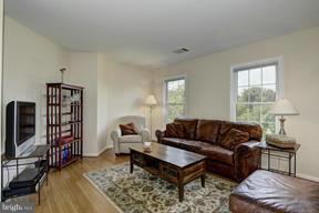 2101 Link Road Silver Spring, MD 20905 - Photo 16 of 30 a living room with furniture a flat screen tv and a window