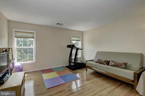 2101 Link Road Silver Spring, MD 20905 - Photo 19 of 30 a bedroom with furniture and a flat screen tv