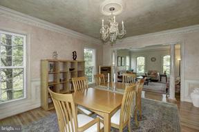 2101 Link Road Silver Spring, MD 20905 - Photo 5 of 30 a view of a dining room with furniture and chandelier
