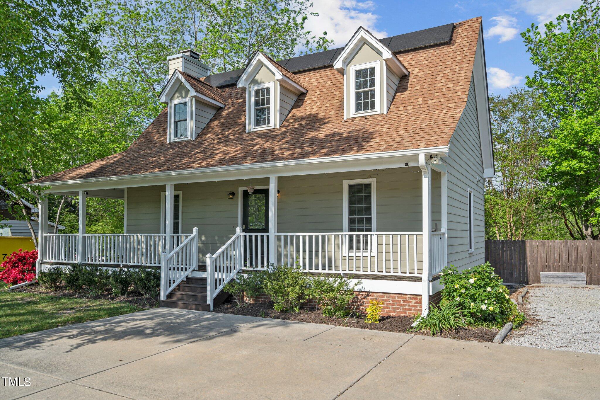 3404 Cartway Lane Raleigh, NC 27616 - Photo 2 of 3 a front view of a house with garden