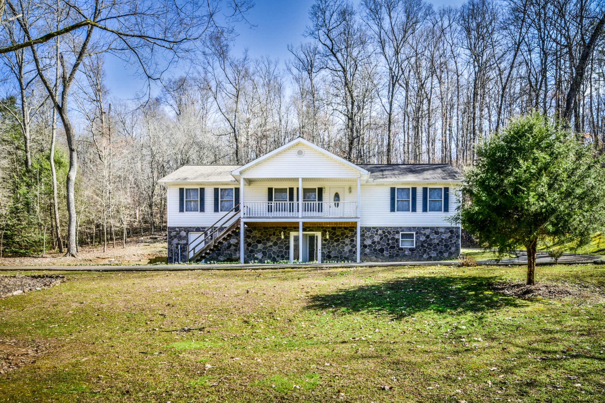 1120 Autumn Breeze Road Newport, TN 37821 - Photo 1 of 38 a front view of a house with a yard table and chairs