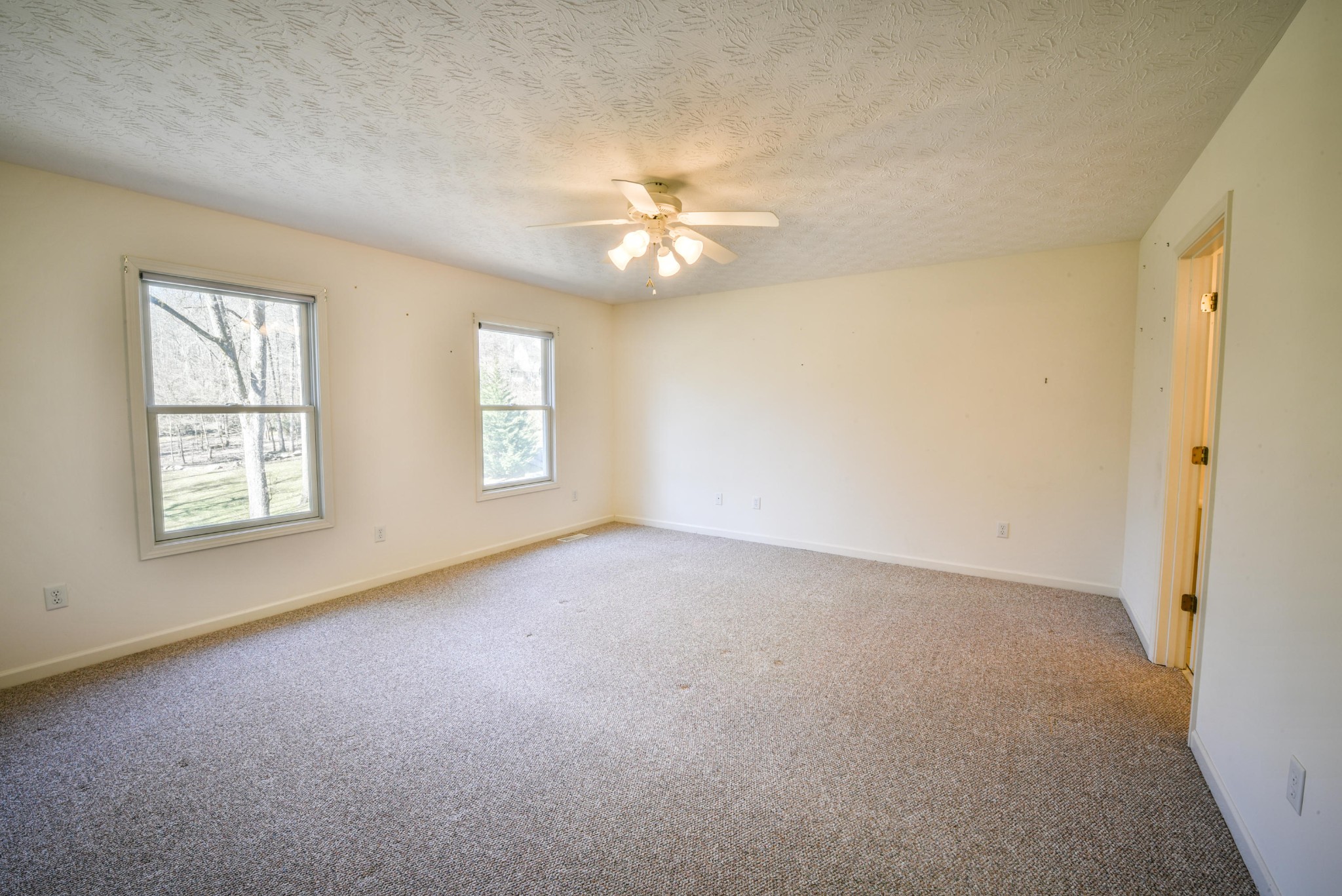 1120 Autumn Breeze Road Newport, TN 37821 - Photo 19 of 38 an empty room with windows and fan
