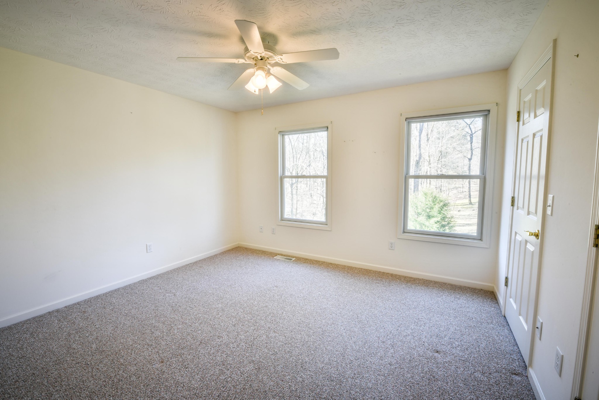 1120 Autumn Breeze Road Newport, TN 37821 - Photo 25 of 38 an empty room with windows and fan