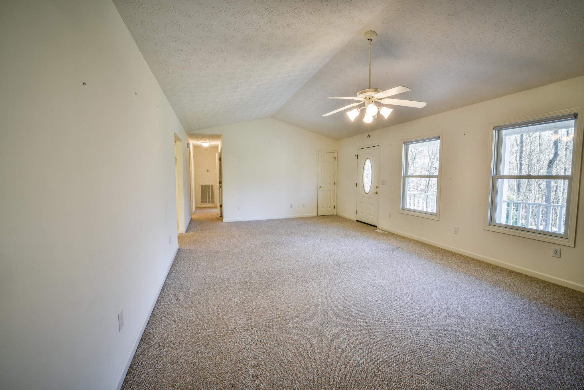 1120 Autumn Breeze Road Newport, TN 37821 - Photo 9 of 38 an empty room with chandelier fan and windows