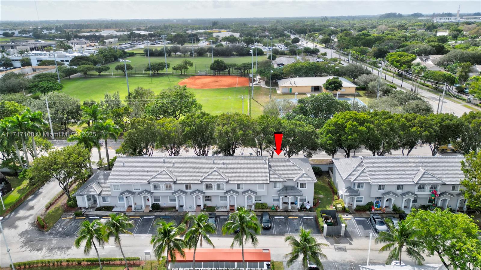 12124 Southwest 143rd Lane, Unit 85 Miami, FL 33186 - Photo 2 of 44 an aerial view of house yard and lake view