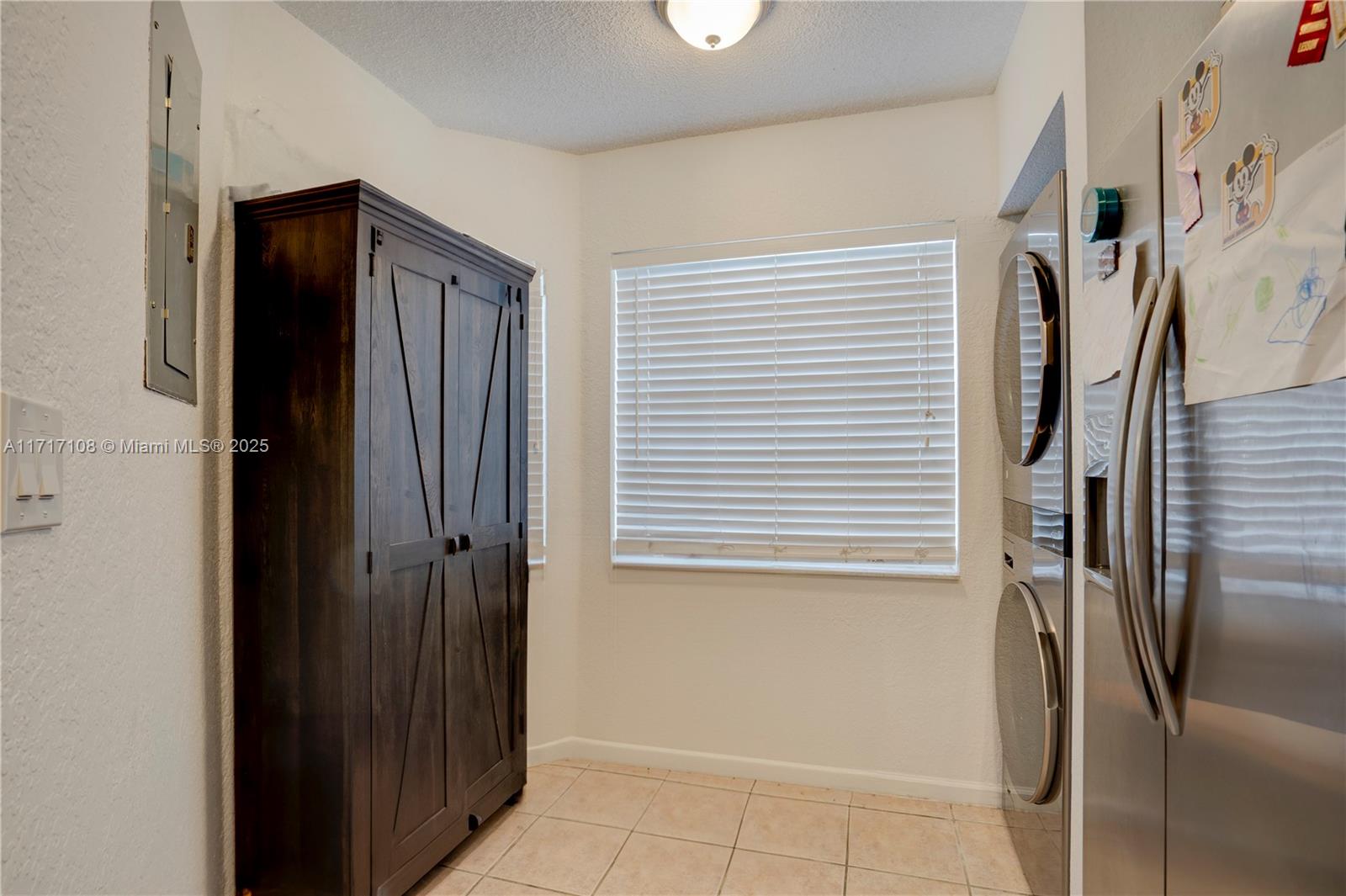 12124 Southwest 143rd Lane, Unit 85 Miami, FL 33186 - Photo 24 of 44 a view of hallway with a refrigerator and a window