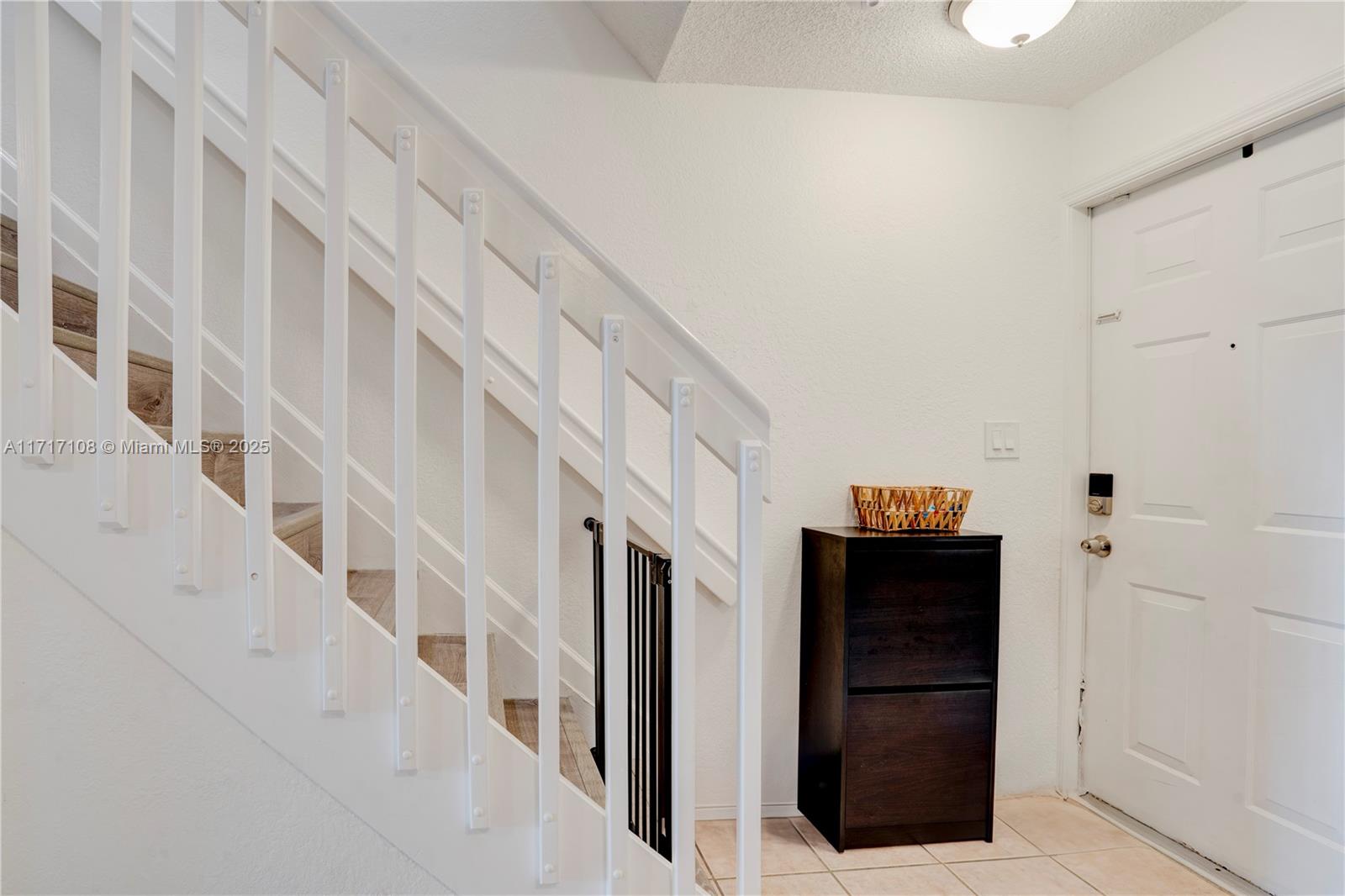 12124 Southwest 143rd Lane, Unit 85 Miami, FL 33186 - Photo 38 of 44 a view of an entryway with staircase