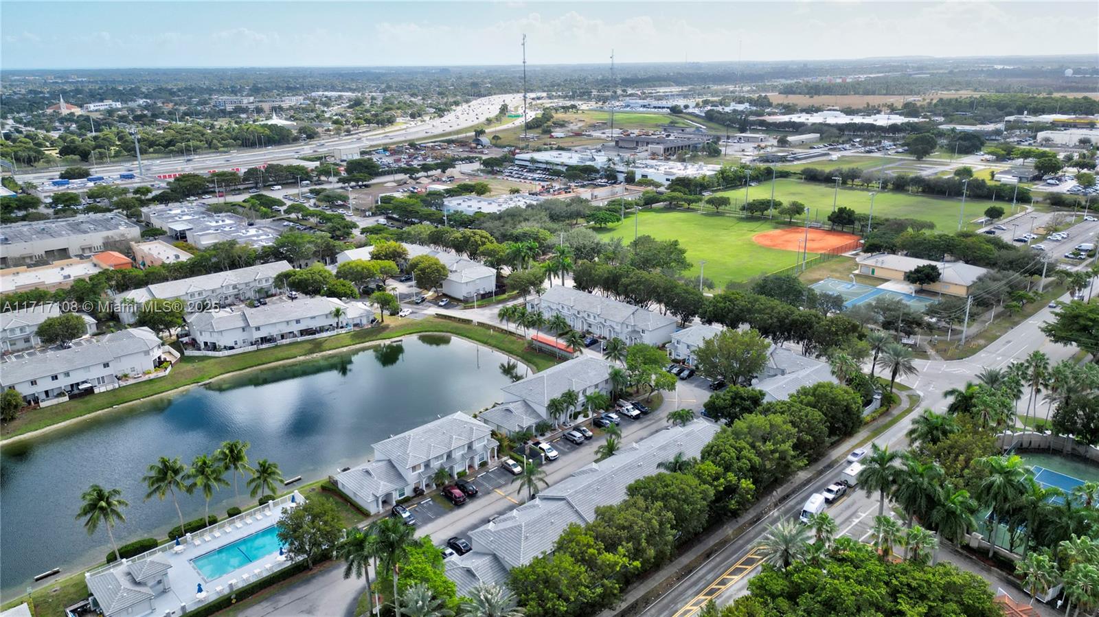 12124 Southwest 143rd Lane, Unit 85 Miami, FL 33186 - Photo 5 of 44 an aerial view of a city with lots of residential buildings