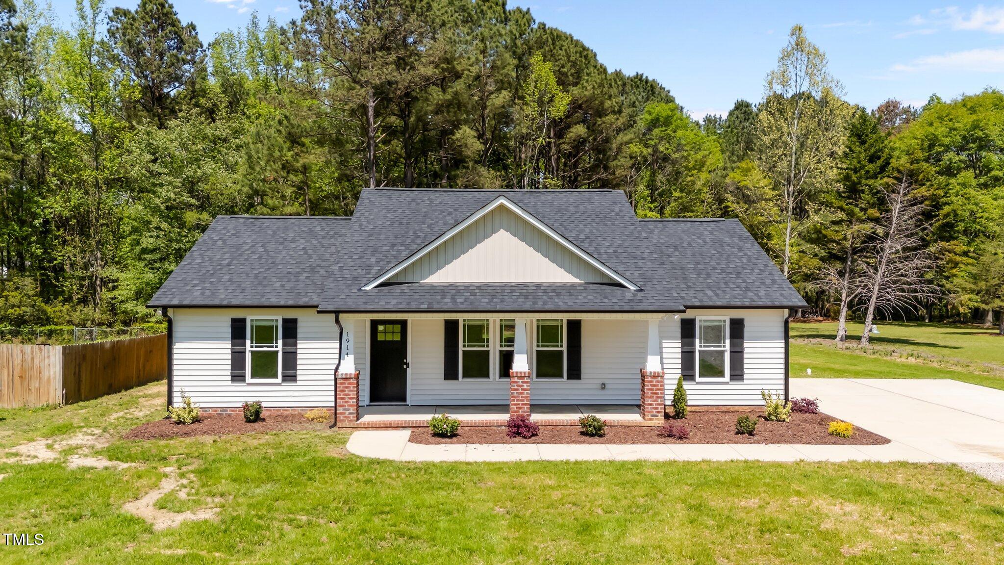 1914 Jack Road Clayton, NC 27520 - Photo 1 of 38 a house view with a garden space