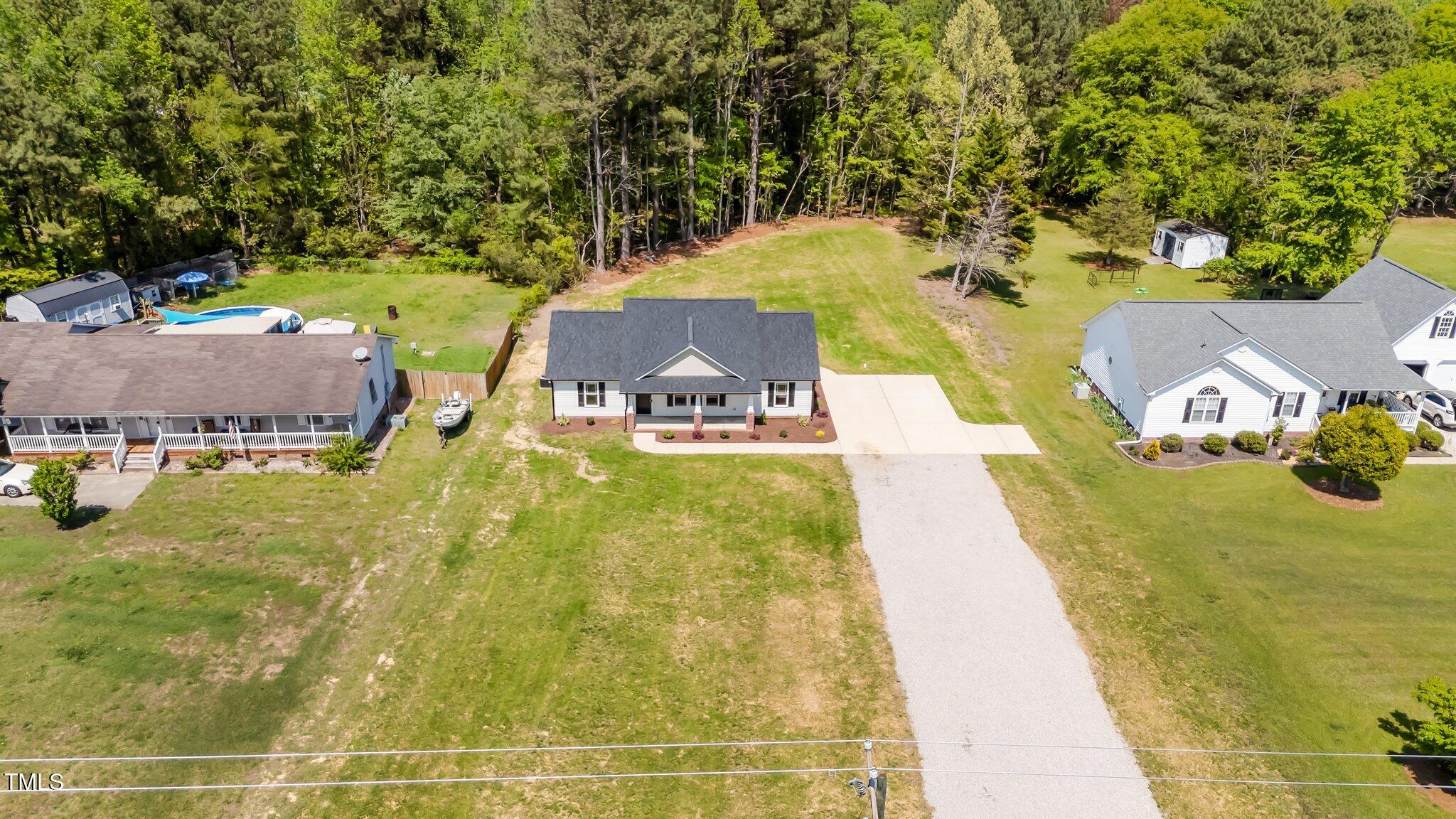 1914 Jack Road Clayton, NC 27520 - Photo 13 of 38 swimming pool view with a sitting space