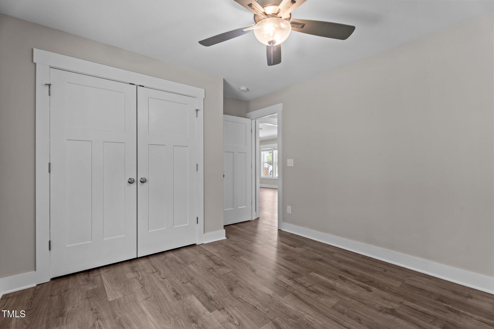 1914 Jack Road Clayton, NC 27520 - Photo 32 of 38 a view of an empty room with wooden floor