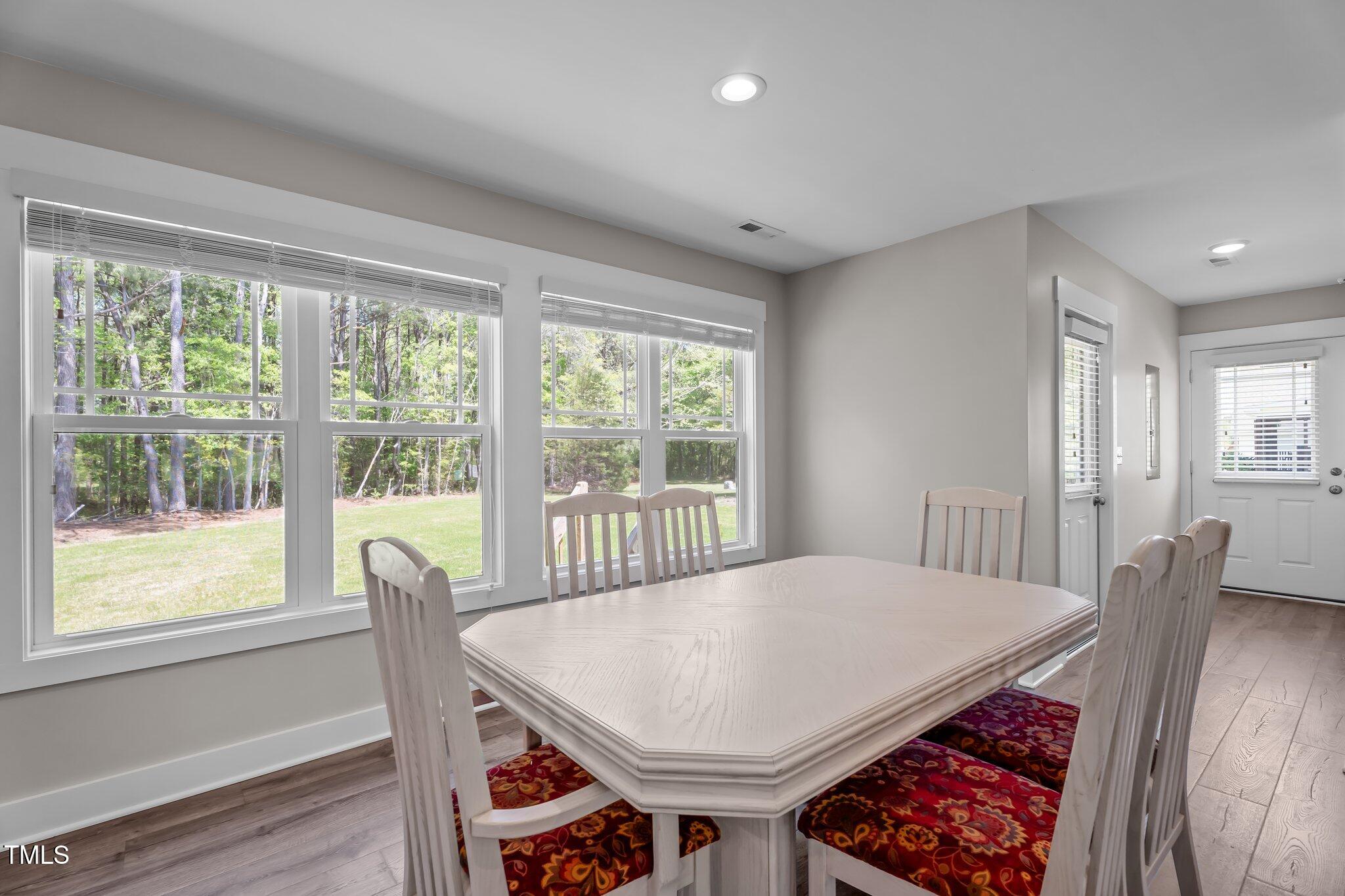 1914 Jack Road Clayton, NC 27520 - Photo 37 of 38 a view of a dining room with furniture window and wooden floor