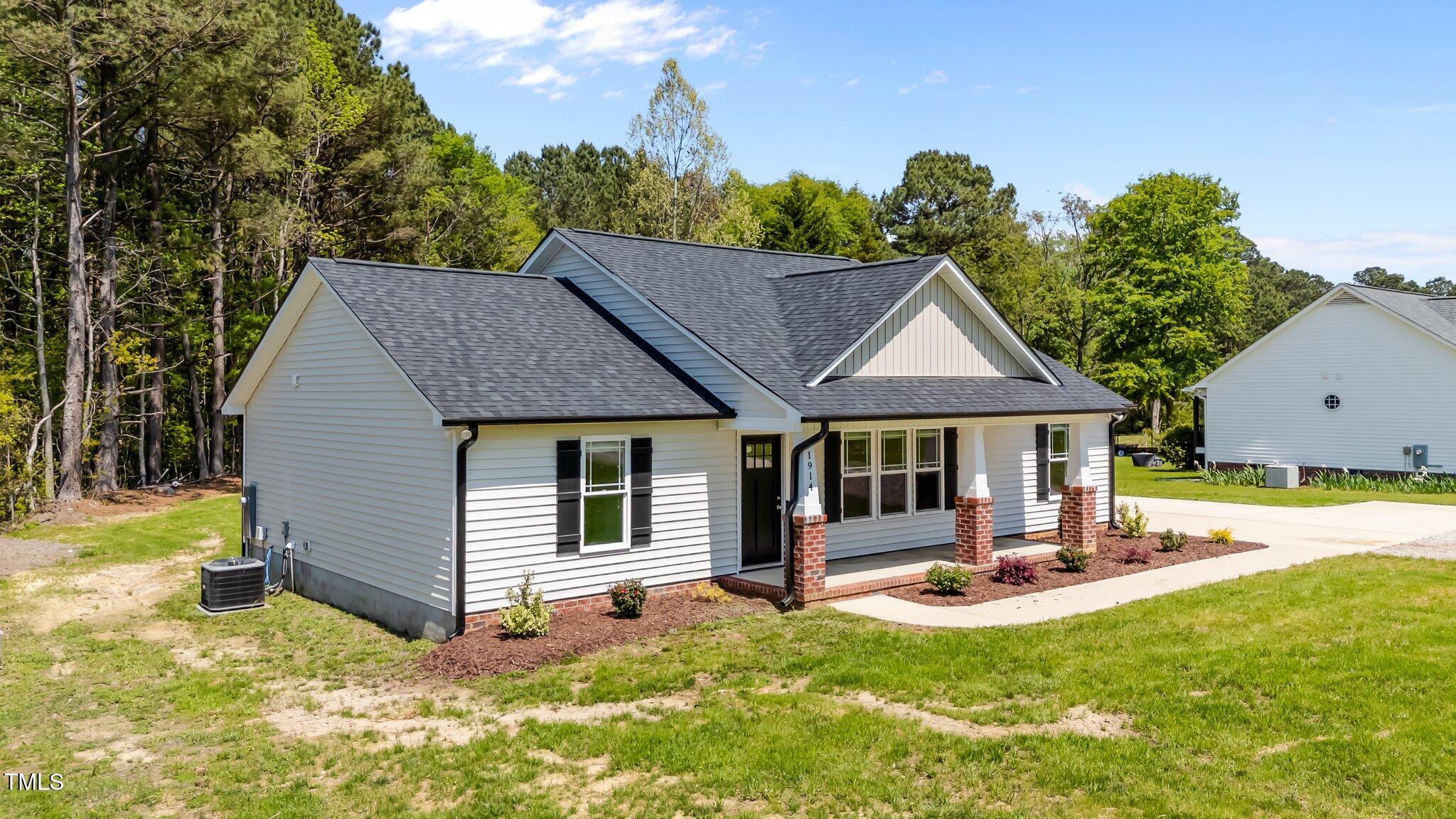 1914 Jack Road Clayton, NC 27520 - Photo 4 of 38 a view of a house with backyard and sitting area