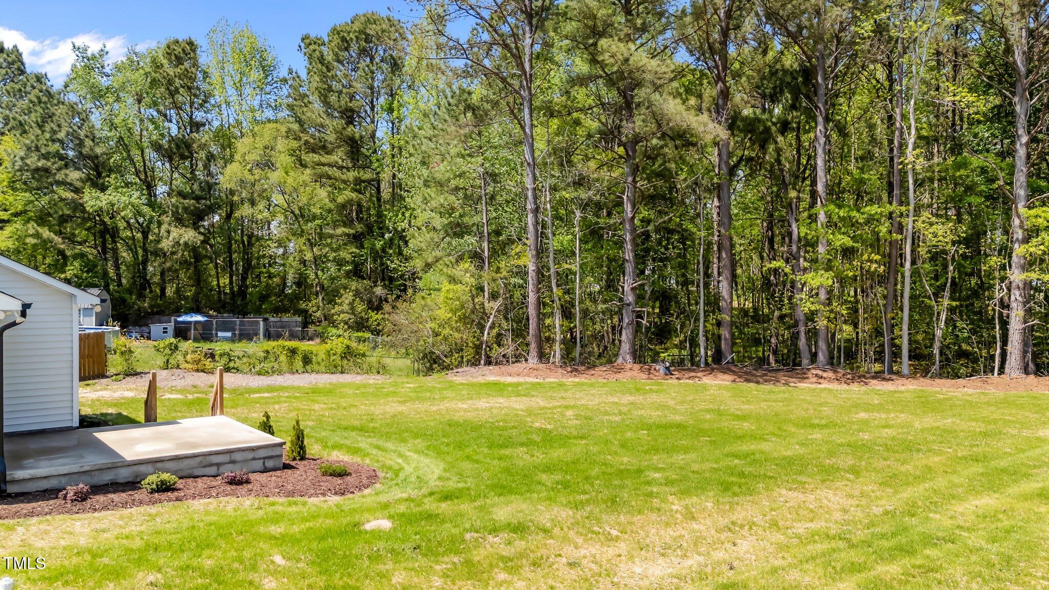 1914 Jack Road Clayton, NC 27520 - Photo 5 of 38 a swimming pool with wooden fence