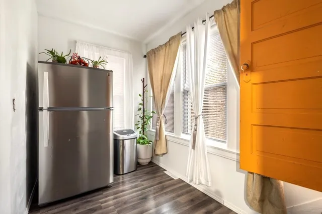 a bed room with a bed and a television