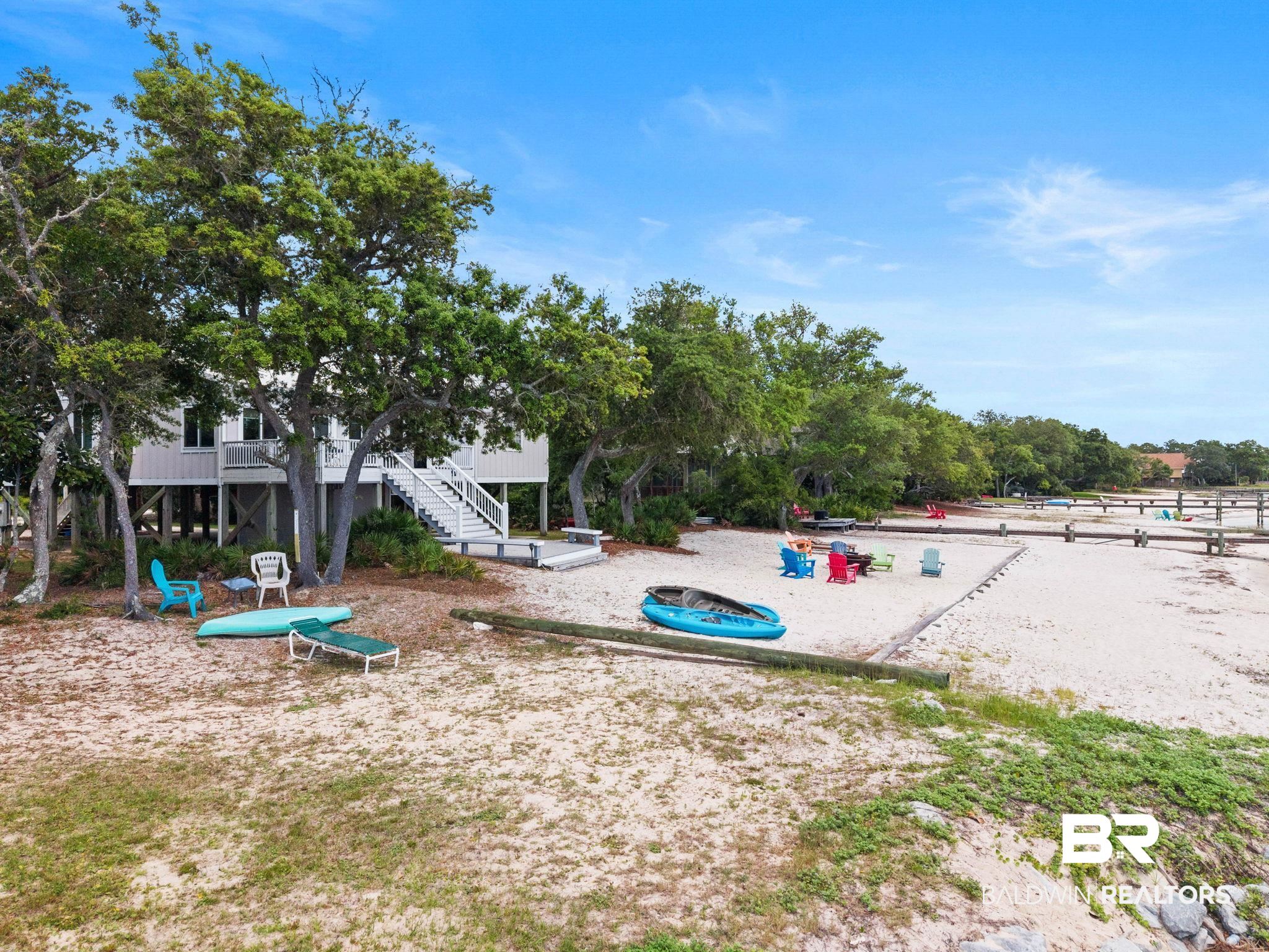6802 Shore Drive Elberta, AL 36530 - Photo 27 of 34 Elevated coastal residence featuring a private sandy beach and mature trees