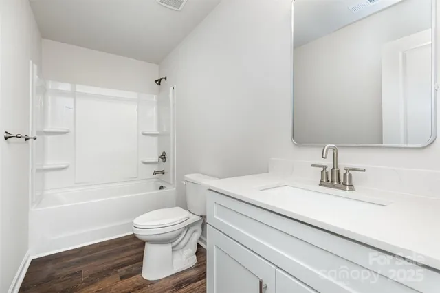 a bathroom with a sink toilet a shower and a mirror