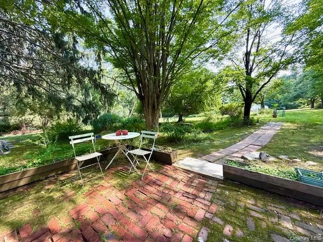 a view of a lake with outdoor seating