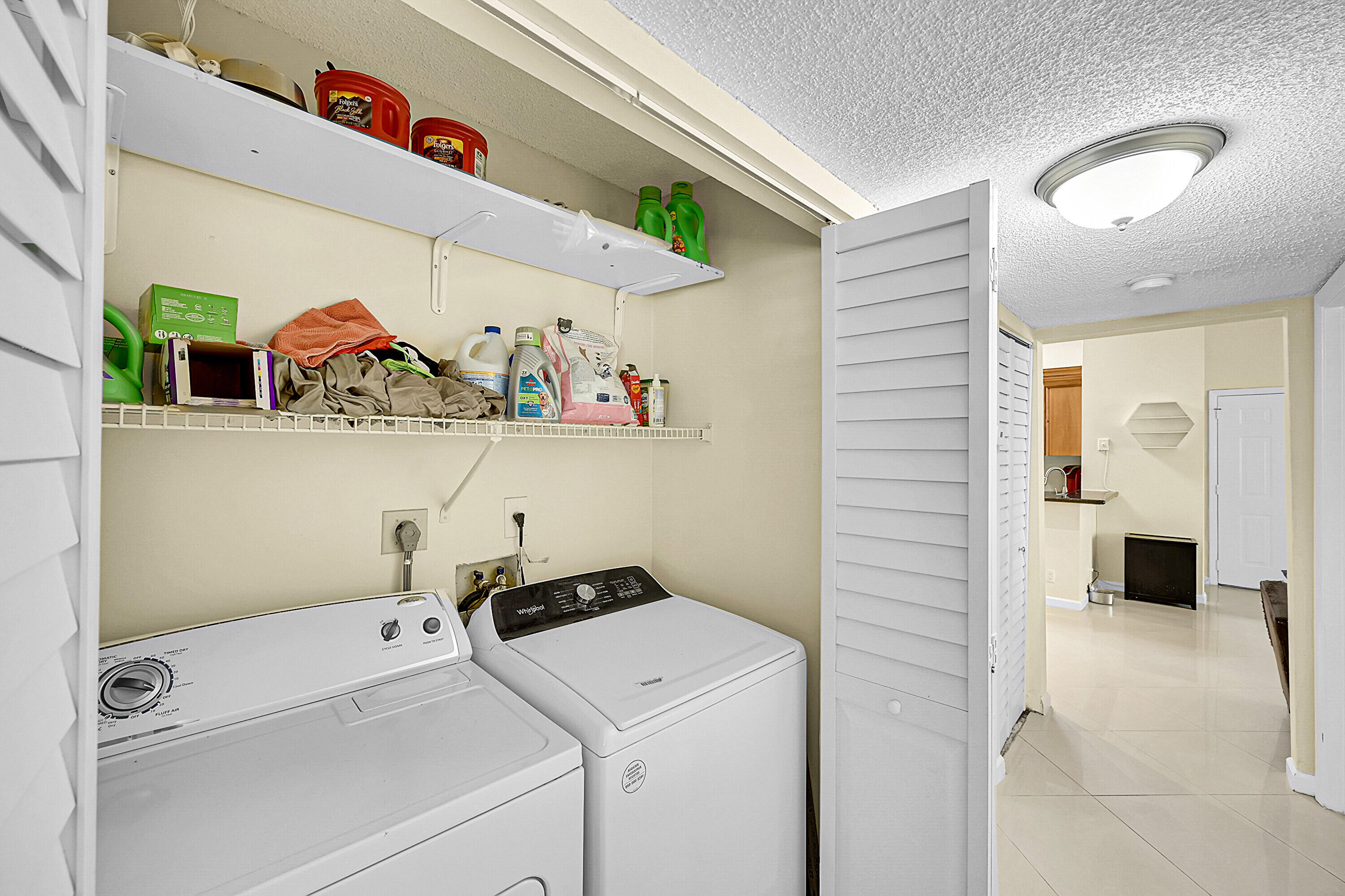 931 Lyons Road, Unit 4201 Coconut Creek, FL 33063 - Photo 15 of 47 a utility room with dryer and washer