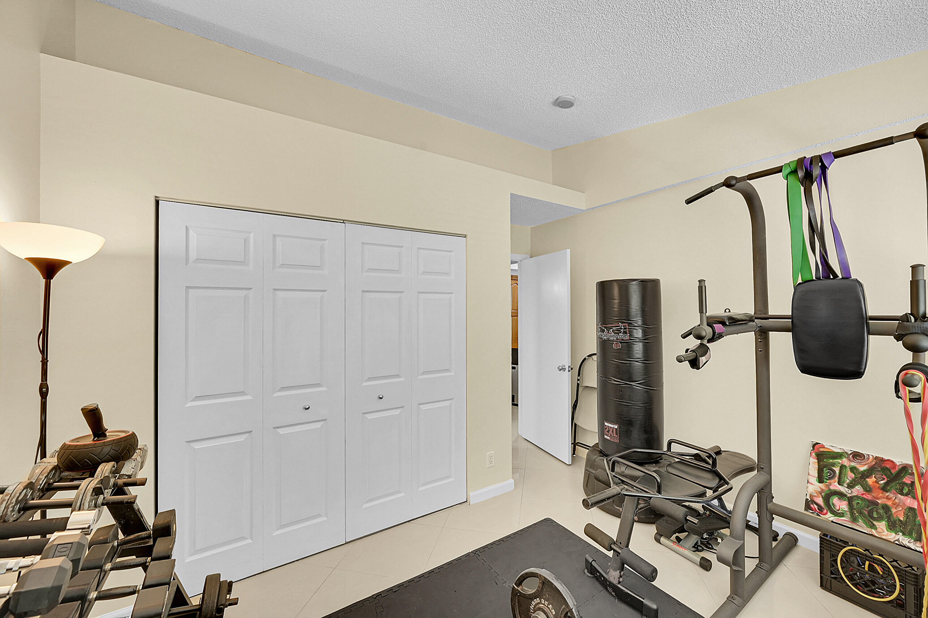 931 Lyons Road, Unit 4201 Coconut Creek, FL 33063 - Photo 17 of 47 a view of walk in closet with clothes and shoes