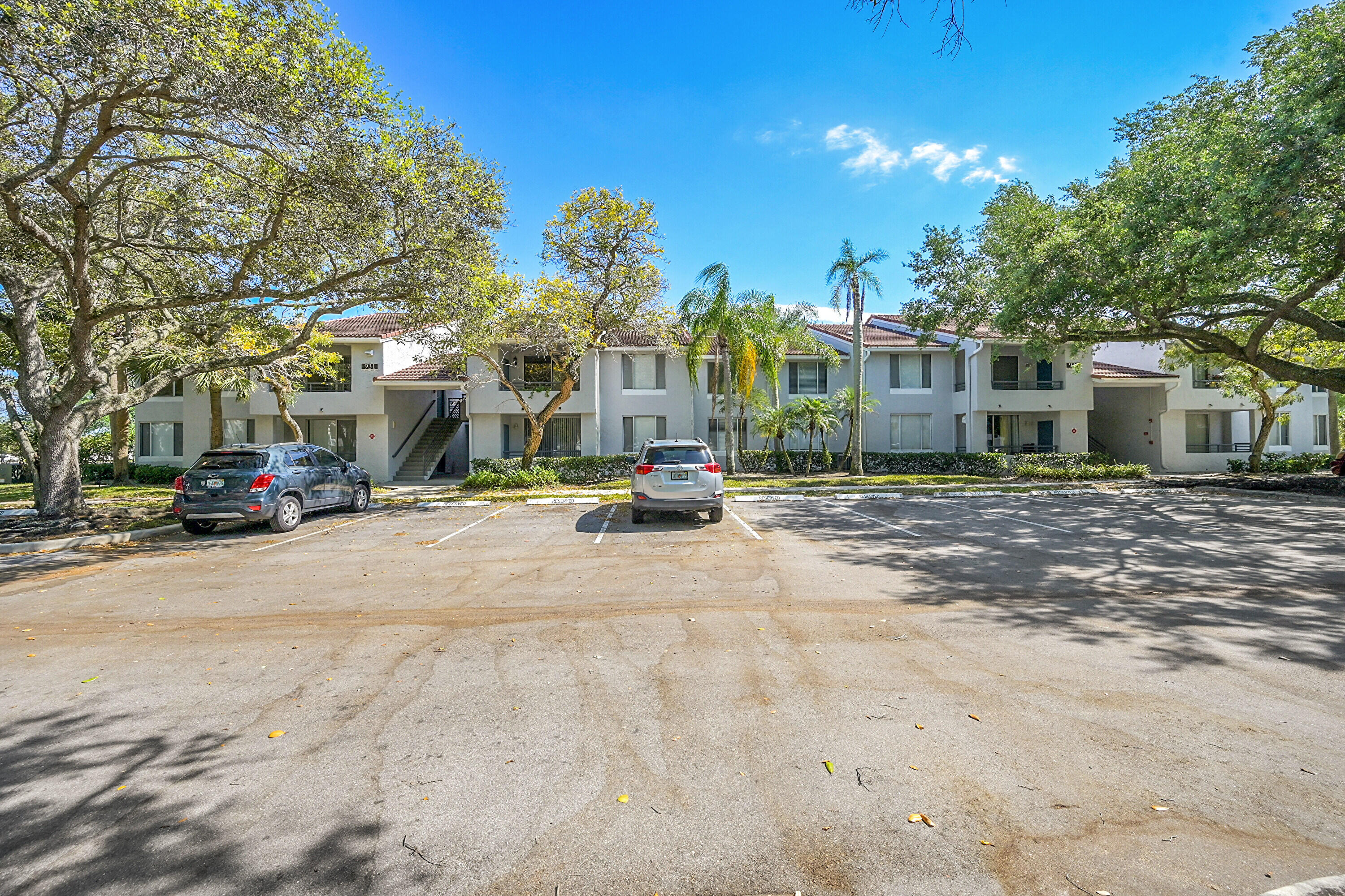 931 Lyons Road, Unit 4201 Coconut Creek, FL 33063 - Photo 20 of 47 a view of a street with a building