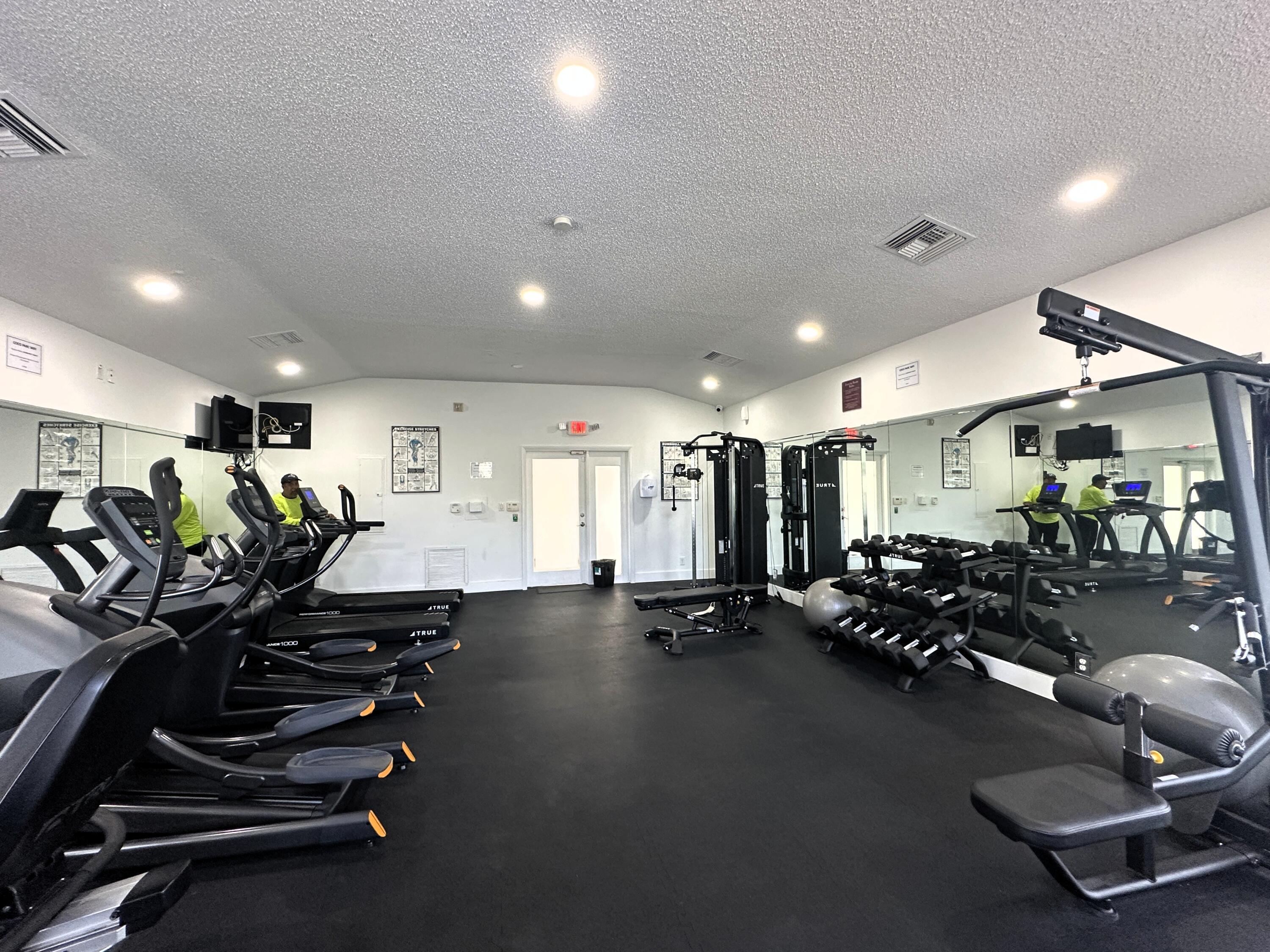 931 Lyons Road, Unit 4201 Coconut Creek, FL 33063 - Photo 27 of 47 a view of a room with gym equipment