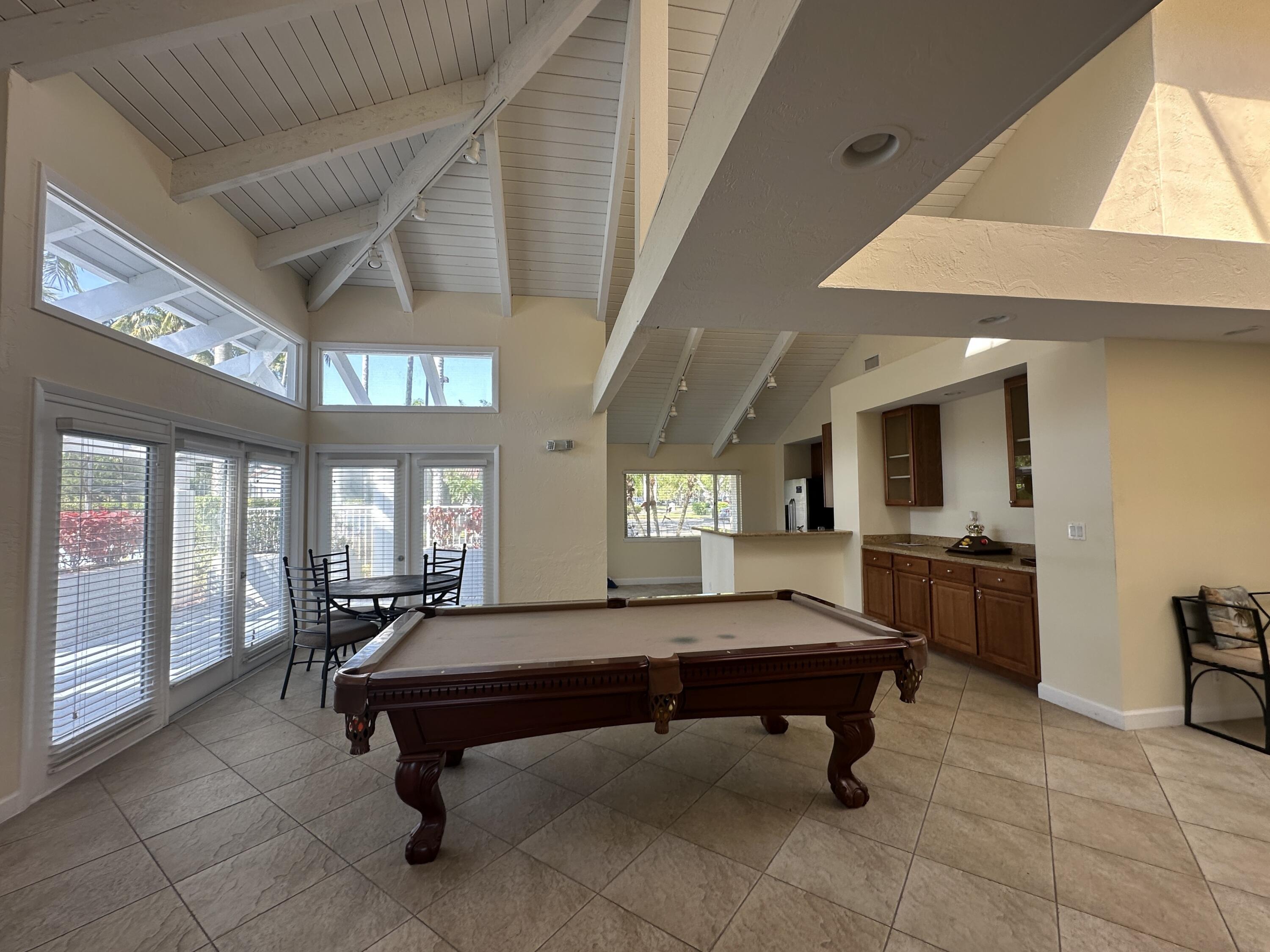 931 Lyons Road, Unit 4201 Coconut Creek, FL 33063 - Photo 31 of 47 a room with pool table and windows