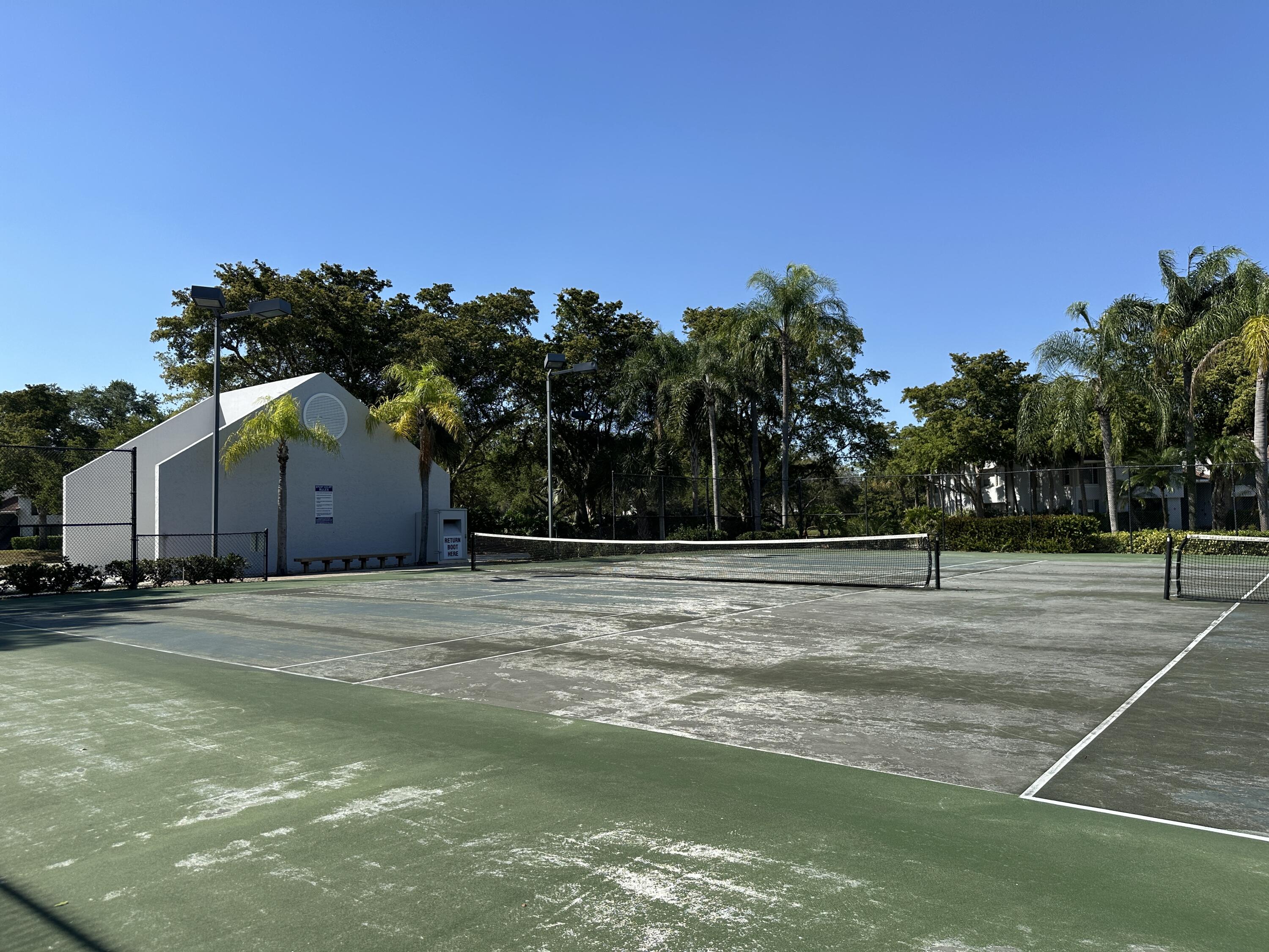 931 Lyons Road, Unit 4201 Coconut Creek, FL 33063 - Photo 34 of 47 a house with yard in front of it