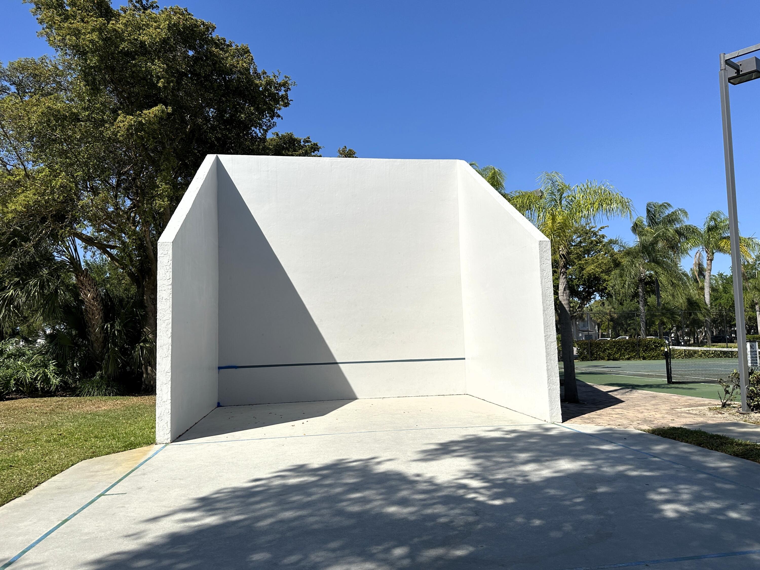 931 Lyons Road, Unit 4201 Coconut Creek, FL 33063 - Photo 35 of 47 a view of a white house with a big yard