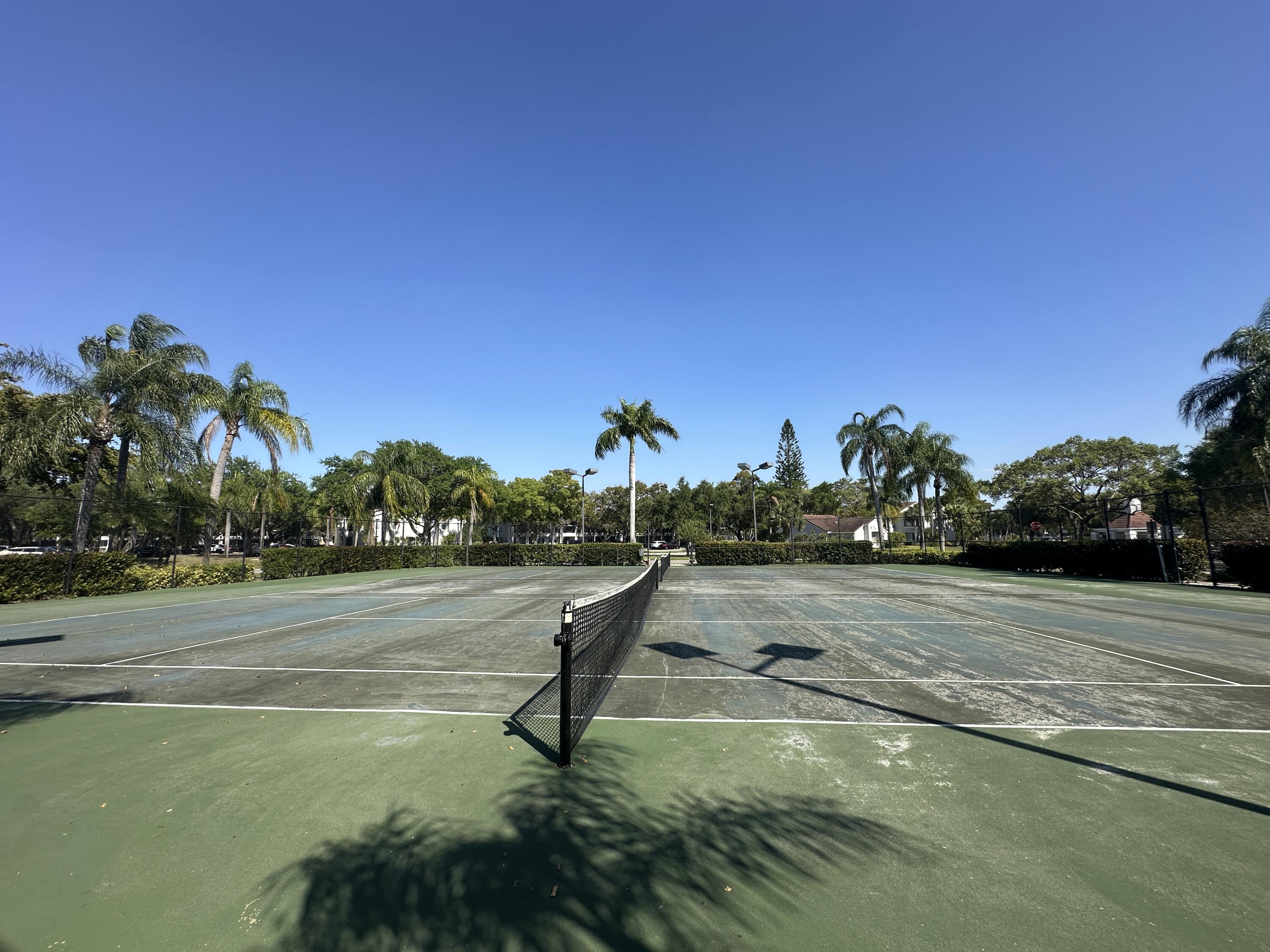 931 Lyons Road, Unit 4201 Coconut Creek, FL 33063 - Photo 36 of 47 a view of a lake with a houses