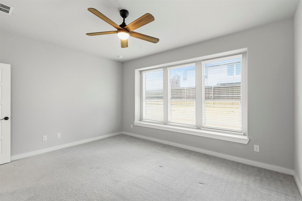 3311 Willena Road Melissa, TX 75454 - Photo 28 of 40 Room featuring light gray walls, gray carpeting, and a multi-pane window with white blinds