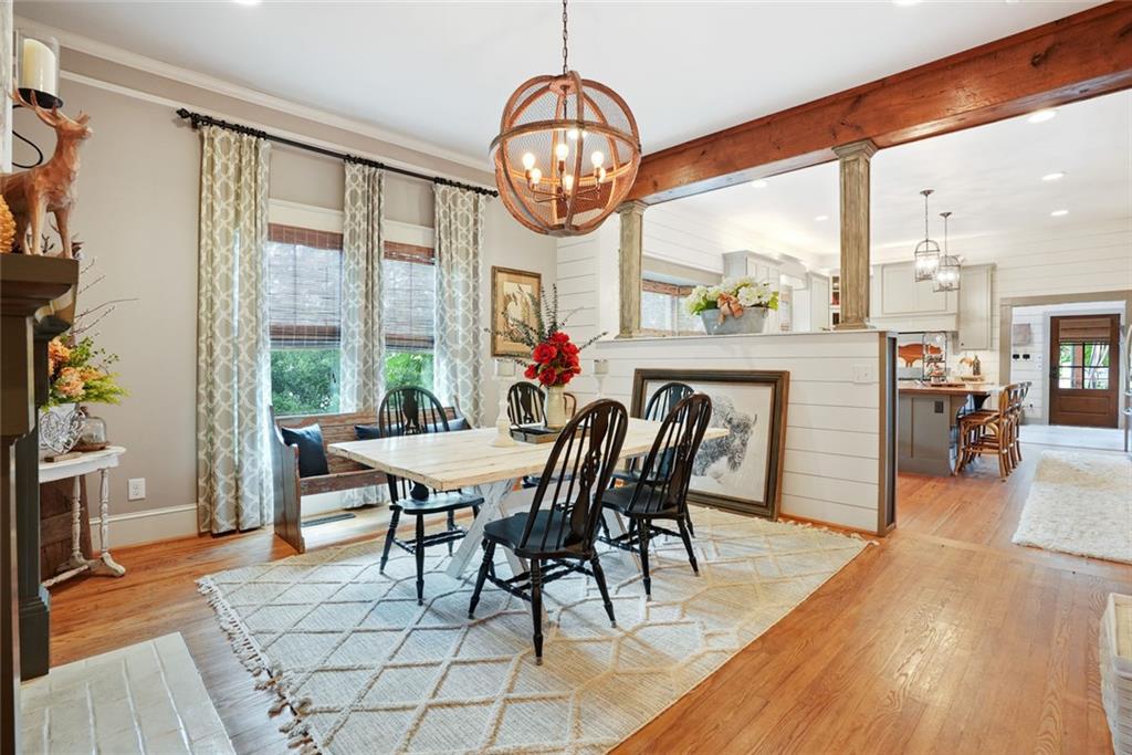 745 Washington Street Clarkesville, GA 30523 - Photo 11 of 54 a view of a dining room with furniture a chandelier and wooden floor