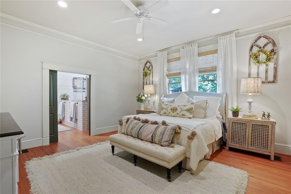 745 Washington Street Clarkesville, GA 30523 - Photo 28 of 54 a spacious bedroom with a bed and a couch