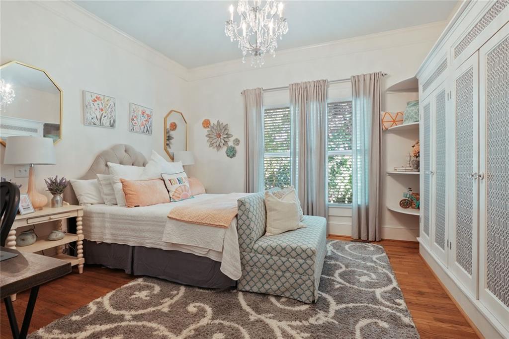 745 Washington Street Clarkesville, GA 30523 - Photo 35 of 54 a bedroom with a bed wooden floor and a large window