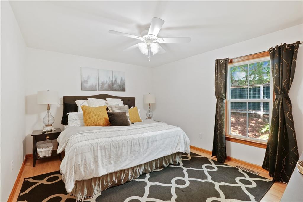 745 Washington Street Clarkesville, GA 30523 - Photo 48 of 54 a bedroom with a bed and a window