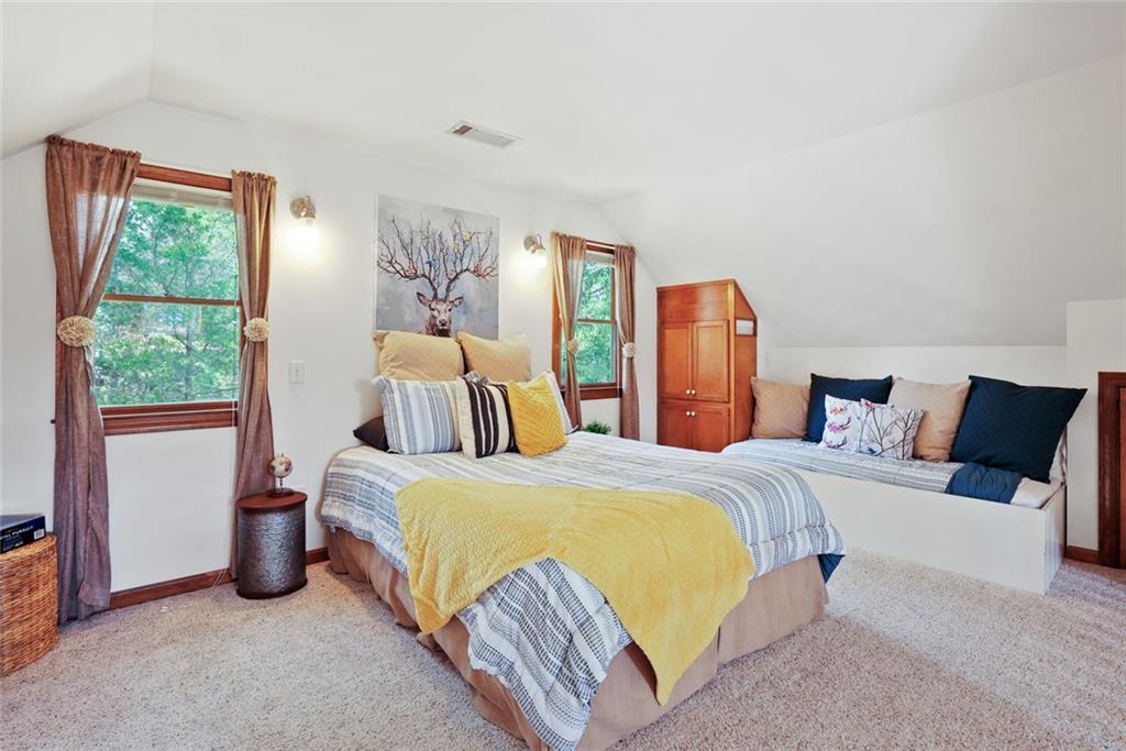 745 Washington Street Clarkesville, GA 30523 - Photo 50 of 54 a bedroom with a bed and wooden floor